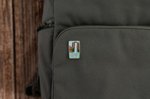 Havasu falls enamel pin on brevite green backpack