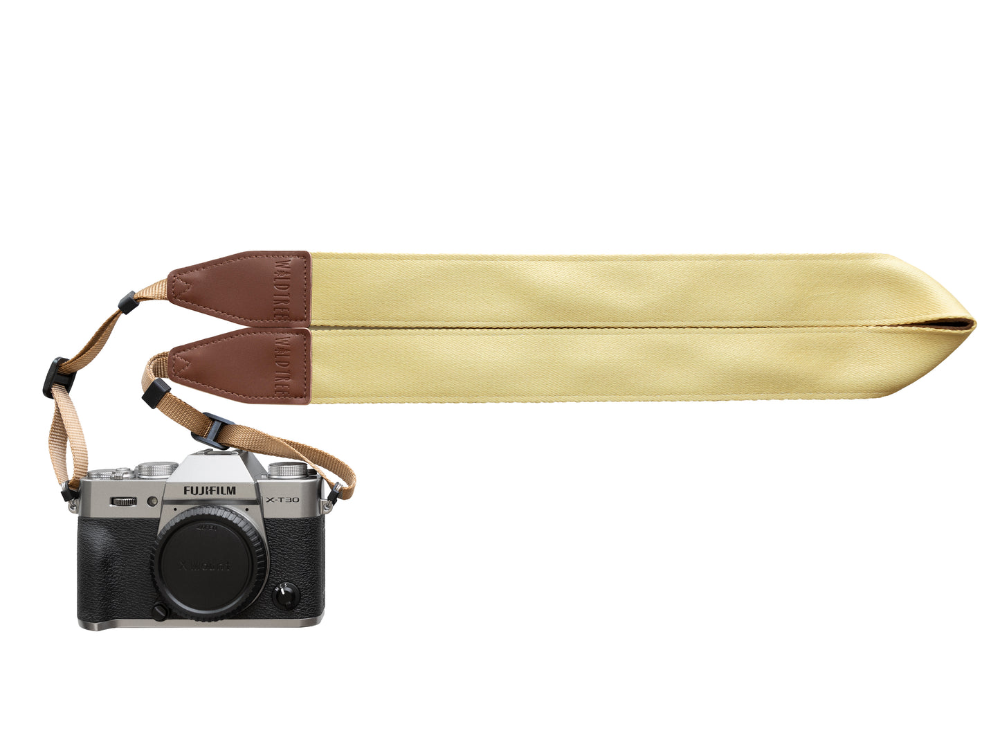 Honey yellow camera strap with brown leather ends connected to fujifilm camera