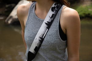 Women wearing Wildtree Wildlife Camera Strap featuring Bear, Moose and Trees with mountain range background 