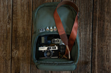 Load image into Gallery viewer, Zion National Park Camera Straps laying on backpack full of cameras
