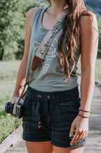 Load image into Gallery viewer, Women holding camera with Wildtree national park camera strap over shoulder
