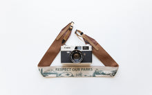 Load image into Gallery viewer, Wildtree Respect our parks national park camera strap attached to film camera

