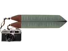 Load image into Gallery viewer, Wildtree Pine tree Camera strap featuring green tree-line attached to Canon film camera
