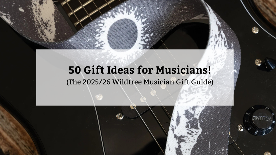 Promotional image showing a black electric guitar with a celestial-patterned strap. The text overlay announces: "50 Gift Ideas for Musicians! (The 2025/26 Wildtree Musician Gift Guide)."