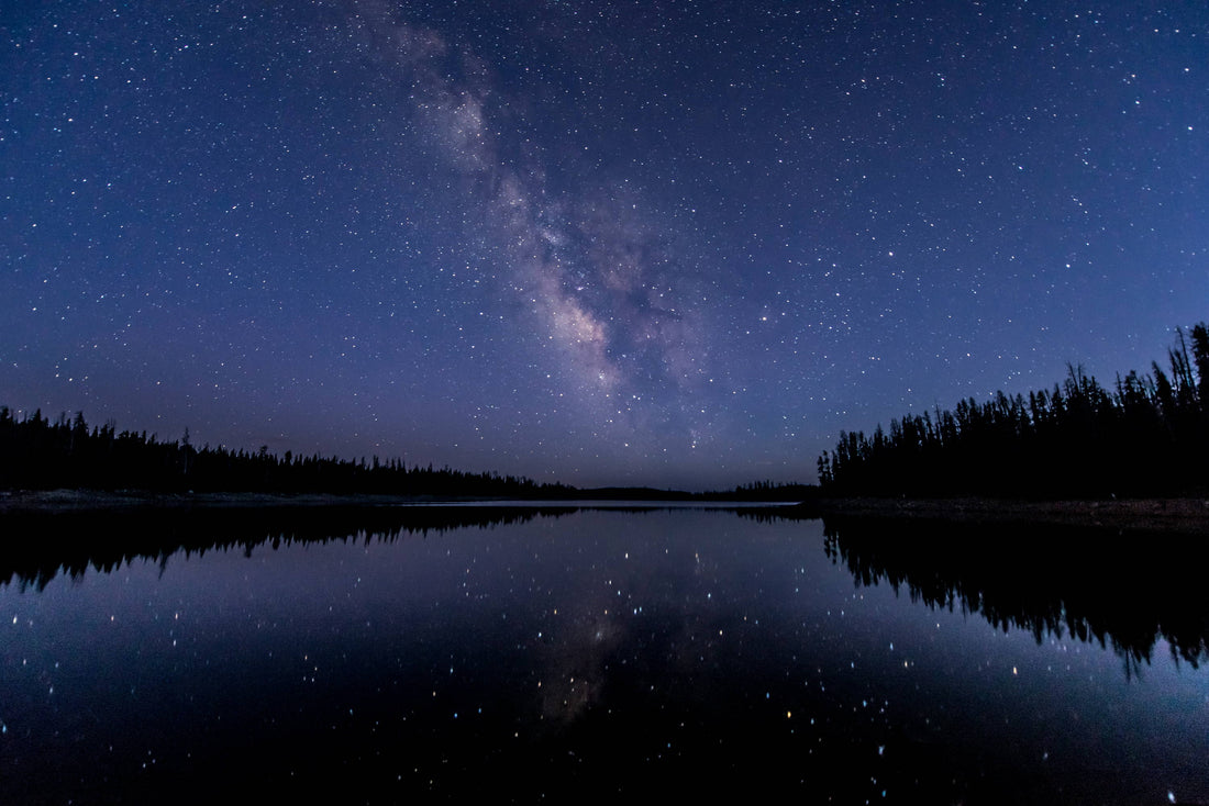 astrophotography image of stars and water