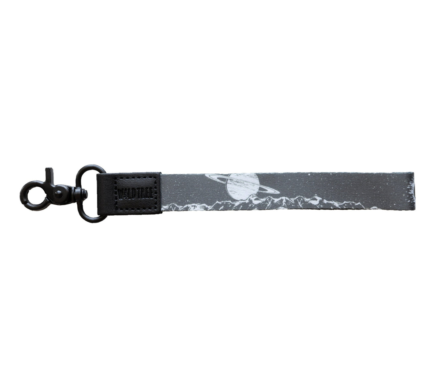 A gray wristlet keychain with a black and white design featuring mountains and a planet with rings, laid out straight on a plain white background.
