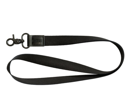 Black Neck Lanyard laid flat on a white background, showing the black strap, black vegan leather patch, and black swivel hook