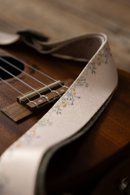 Close up of small colored flower printed on ukulele strap