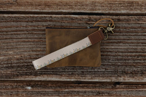tan keychain with printed little flowers