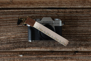 wildtree flower field floral keychain attached to lightweight camera