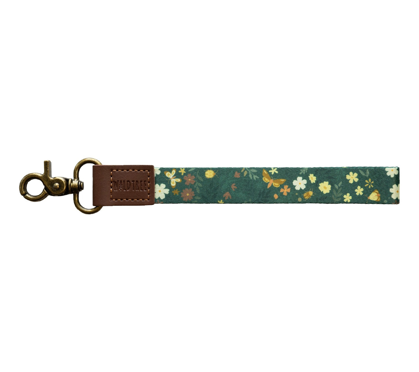 Flat lay of the Flutter & Fern wristlet keychain on a white background, showing the dark green strap printed with white daisies, small brown and yellow flowers, and gold butterflies.