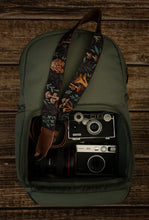 Load image into Gallery viewer, Wildtree Forest Foliage Camera laying out on green brevite backpack - Best camera strap for canon camera.
