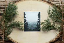 Load image into Gallery viewer, A bear walking in the forest between two big trees sticker
