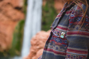 Havasu falls enamel pin attached to womens shirt