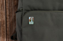 Load image into Gallery viewer, Havasu falls enamel pin on brevite green backpack
