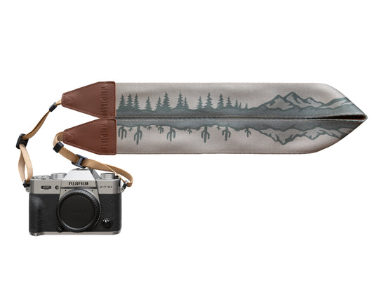 Wildtree Landscape Camera Strap with trees, Cacti and Mountains connected to canon camera