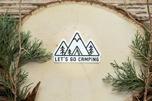 Sticker design of Simplistic line drawing of mountains, tent and trees with the words "Let's go camping"