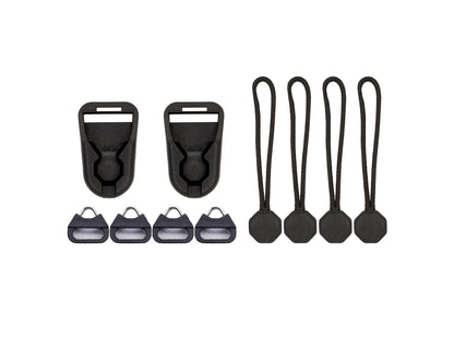 Wildtree low-profile quick-link camera strap adapter kit: two black quick-release buckle connectors, four split-ring anchor adapters, and four paracord quick-link pulls with octagonal toggles, laid flat on a white background