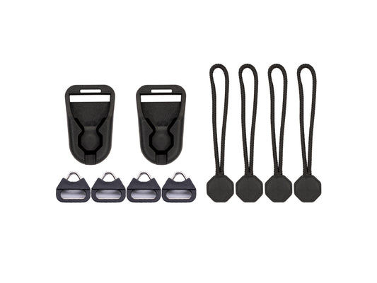 Wildtree low-profile quick-link camera strap adapter kit: two black quick-release buckle connectors, four split-ring anchor adapters, and four paracord quick-link pulls with octagonal toggles, laid flat on a white background