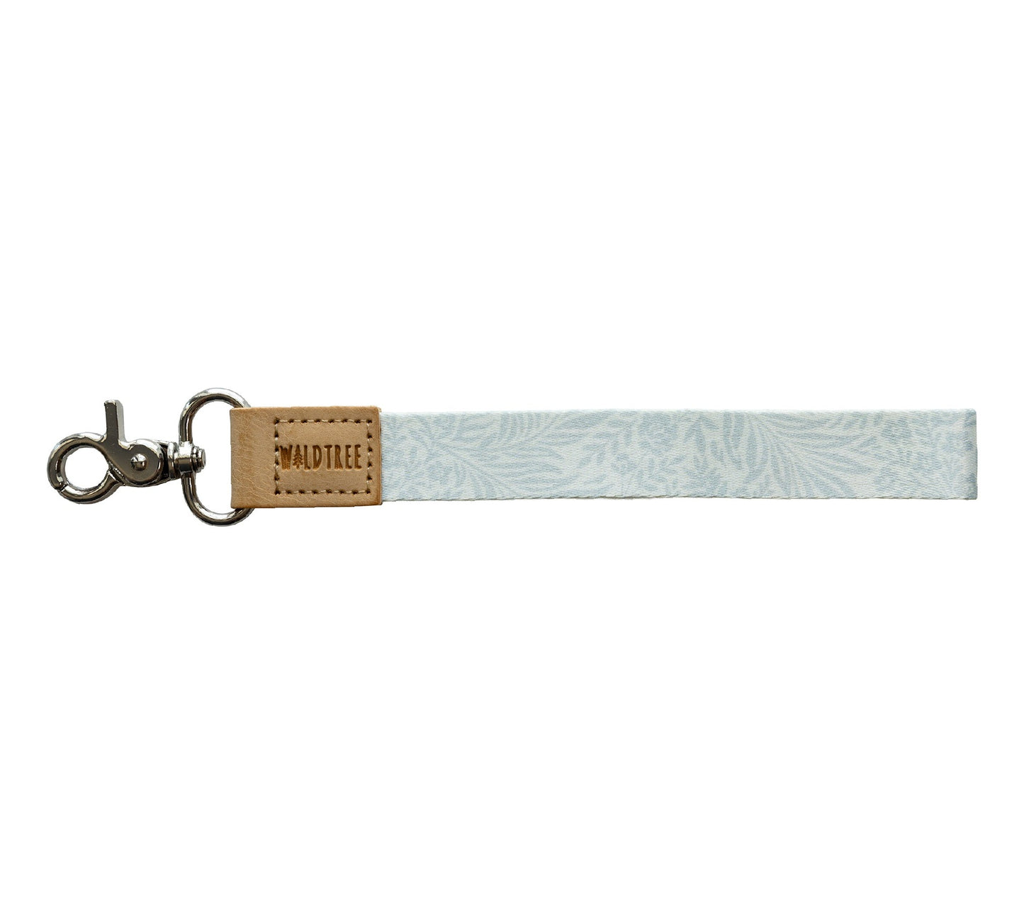 Flat lay of the Meadow Mist wristlet keychain on a white background, showing the pale sage fern-print strap.