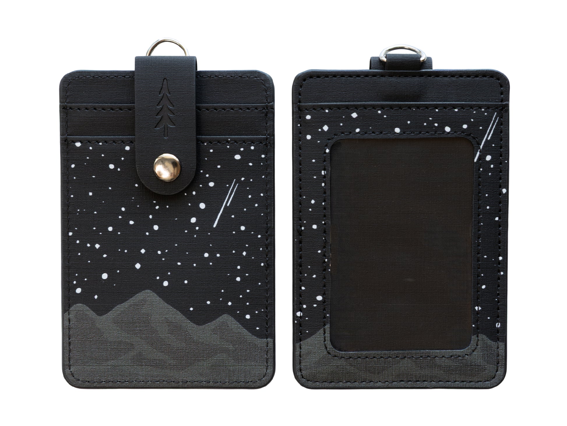 A detailed close-up shot focusing on the back details of the Midnight Mountain vertical card wallet while being worn outdoors. It beautifully frames the contrast between the dark gray mountain peaks, the white stars on black fabric, and the brown faux-leather strap securing the hidden card pockets.