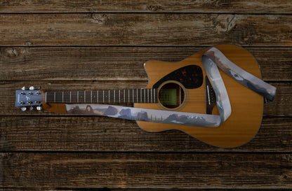 national park guitar strap attached to acoustic guitar