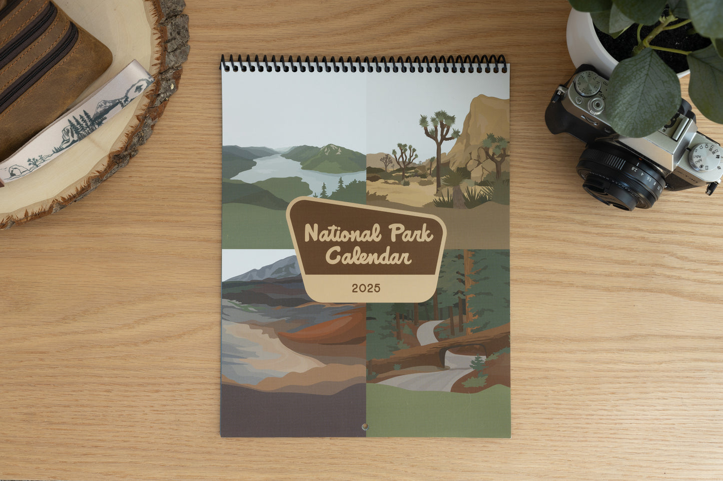 front cover of National park calendar for year 2025 featuring 4 illustrations from 4 months in the calendar. Words "National park calendar 2025" in center in shape of national park sign.