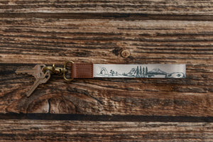 national park wristlet keychain laying on wood floor