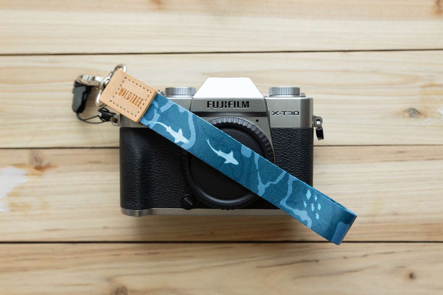 Ocean design wristlet keychain attached to Fujifilm camera