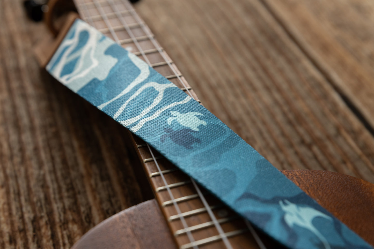 close up of sea turtles printed on ukulele strap