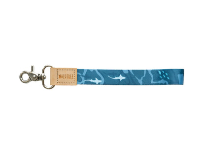 Ocean design wristlet keychain featuring blue waves, sharks