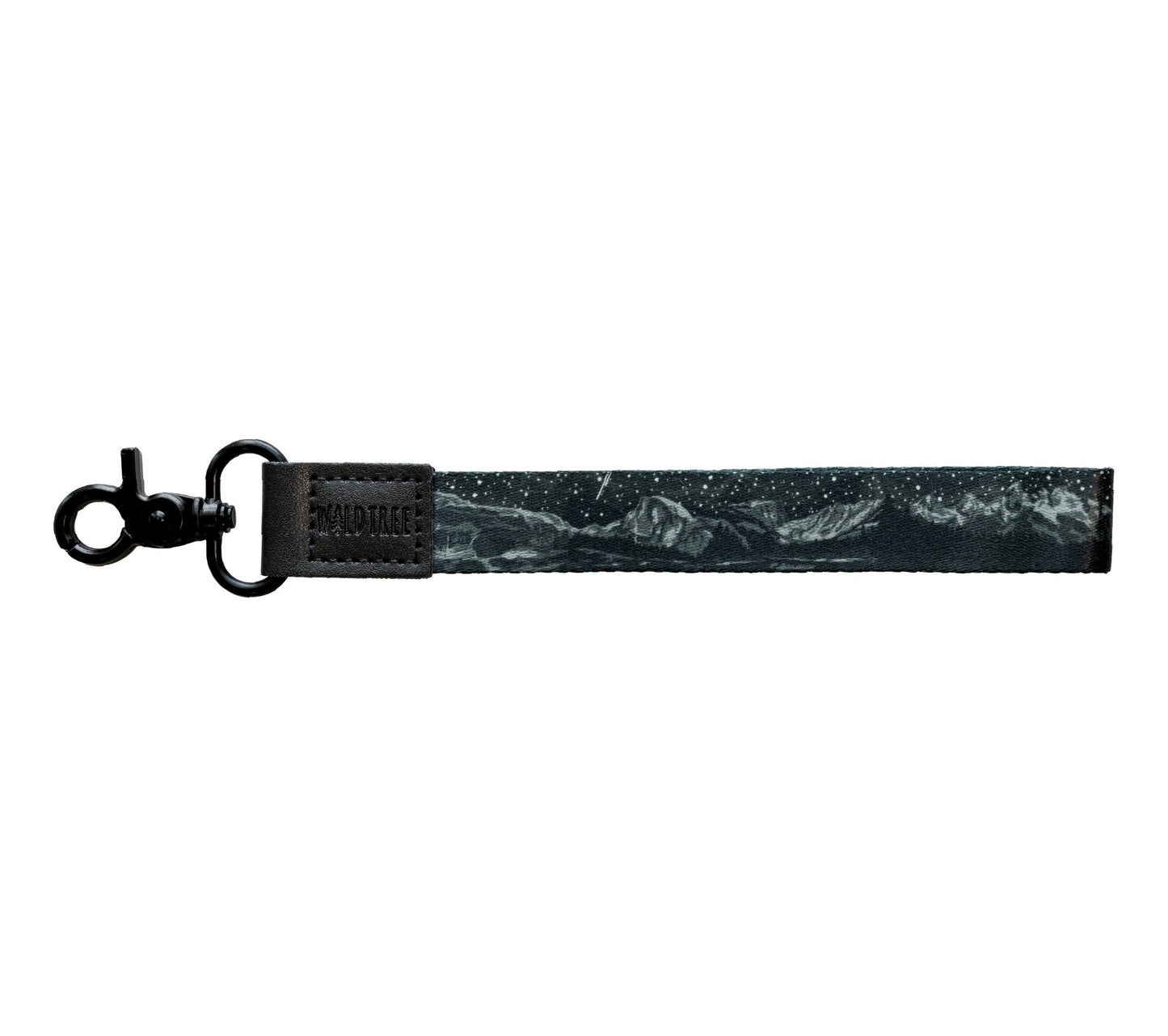 Flat lay of the Parks at Night wristlet keychain on a white background, showing the black strap printed with a night sky scene featuring mountain range silhouettes.