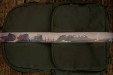 Load image into Gallery viewer, National parks camera strap in color laying out on green brevite back pack. -  Best camera strap for Canon cameras and all other makes and models. 
