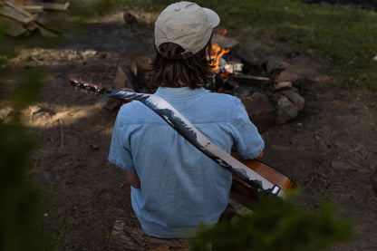 Parks in black and white on guitar by campfire