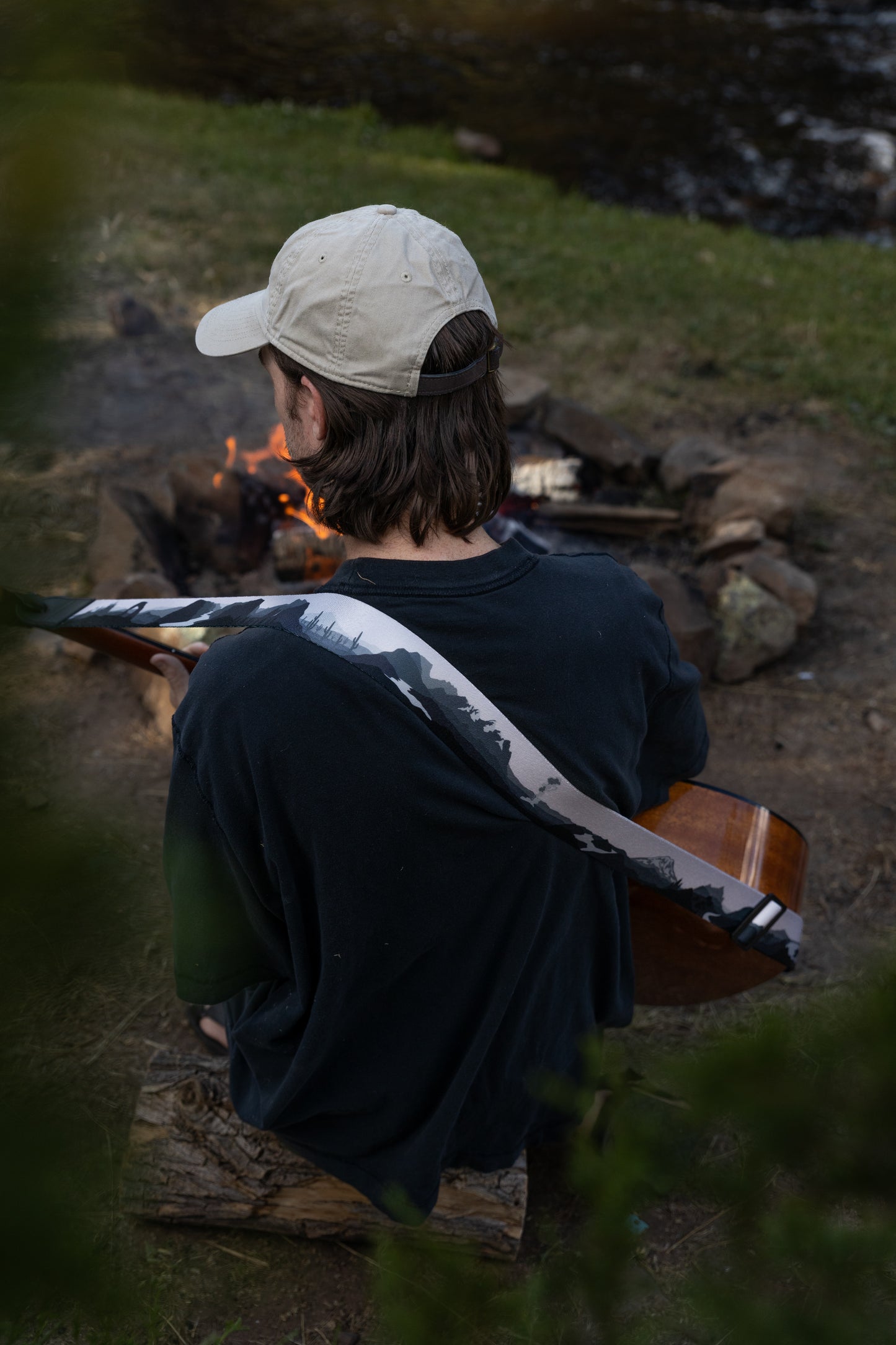 Parks in black and white on guitar by campfire