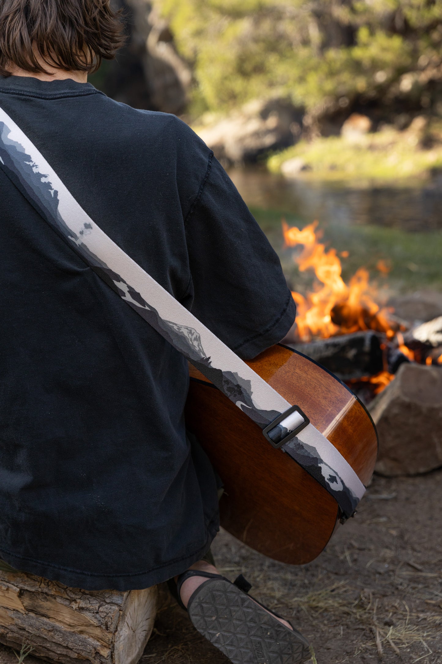 Parks in black and white on guitar by campfire