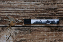 Load image into Gallery viewer, national park wristlet keychain black and white attached to keys
