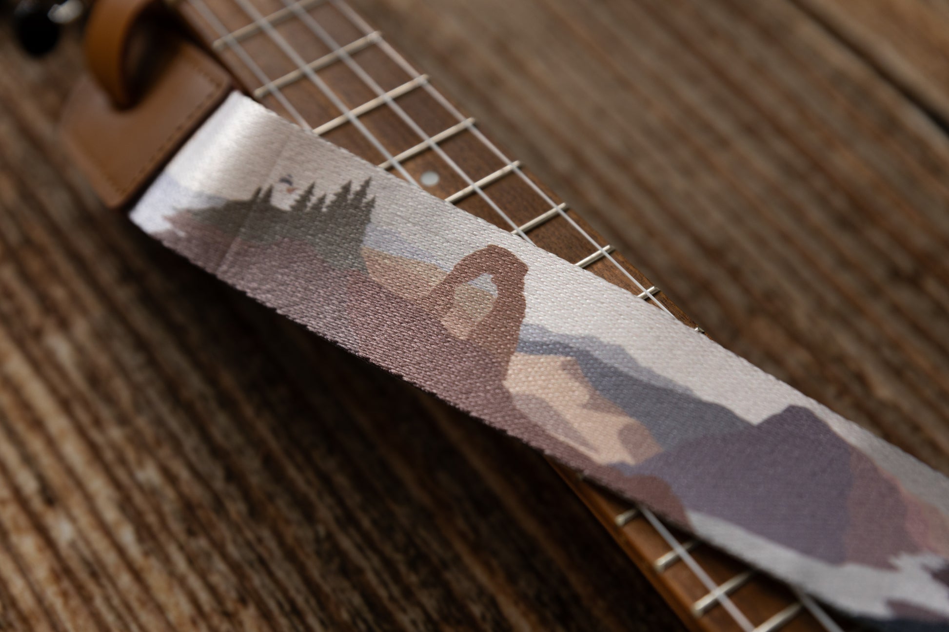 close up of Arches national park design printed on ukulele strap