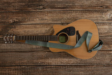 Load image into Gallery viewer, Pinetree printed guitar strap attached to acoustic guitar lying on wood floor
