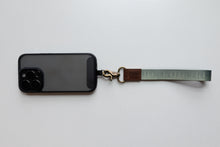Load image into Gallery viewer, pinetree keychain attached to phone case

