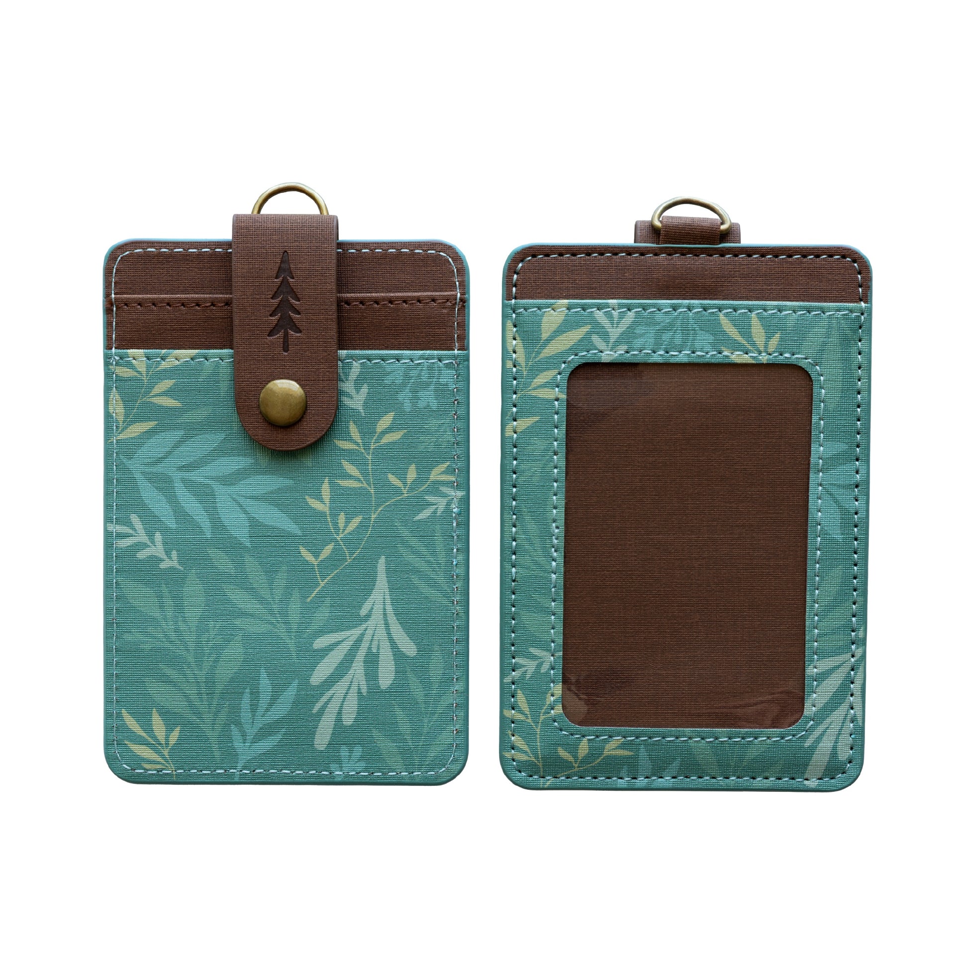 A studio product shot showing both the front and back of the green botanical ID holder isolated on a white background. It provides a clean, clear view of the clear ID window, back card slots, and pine tree snap closure.