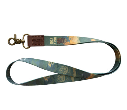 Product photography of the Smokey Bear lanyard on a plain white background, laid out to show the double-sided print.