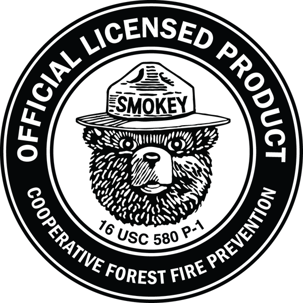 Circular logo with Smokey Bear wearing a firefighter hat and text 'Official Licensed Product' and 'Cooperative Forest Fire Prevention'.