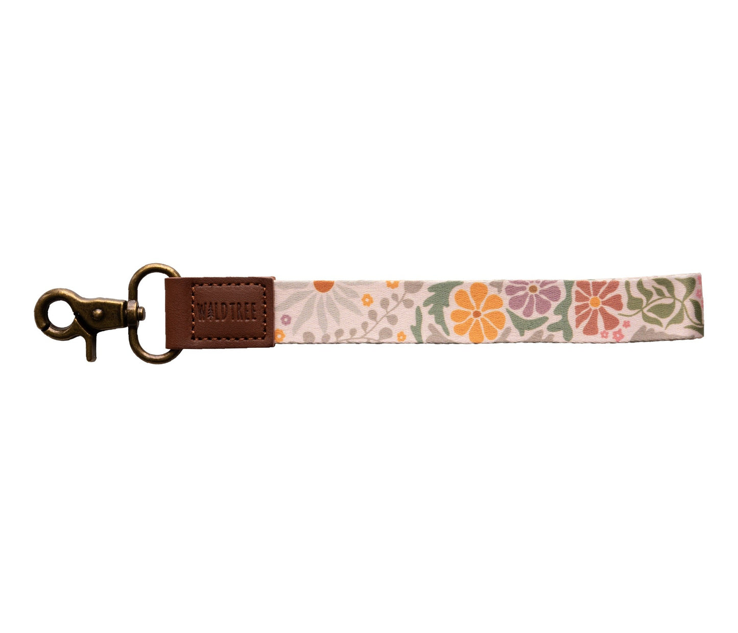 "Wildtree sunset floral wristlet keychain" (Wildtree design) on white. Light tan strap with vibrant orange, pink, muted green floral pattern (sunset inspired).