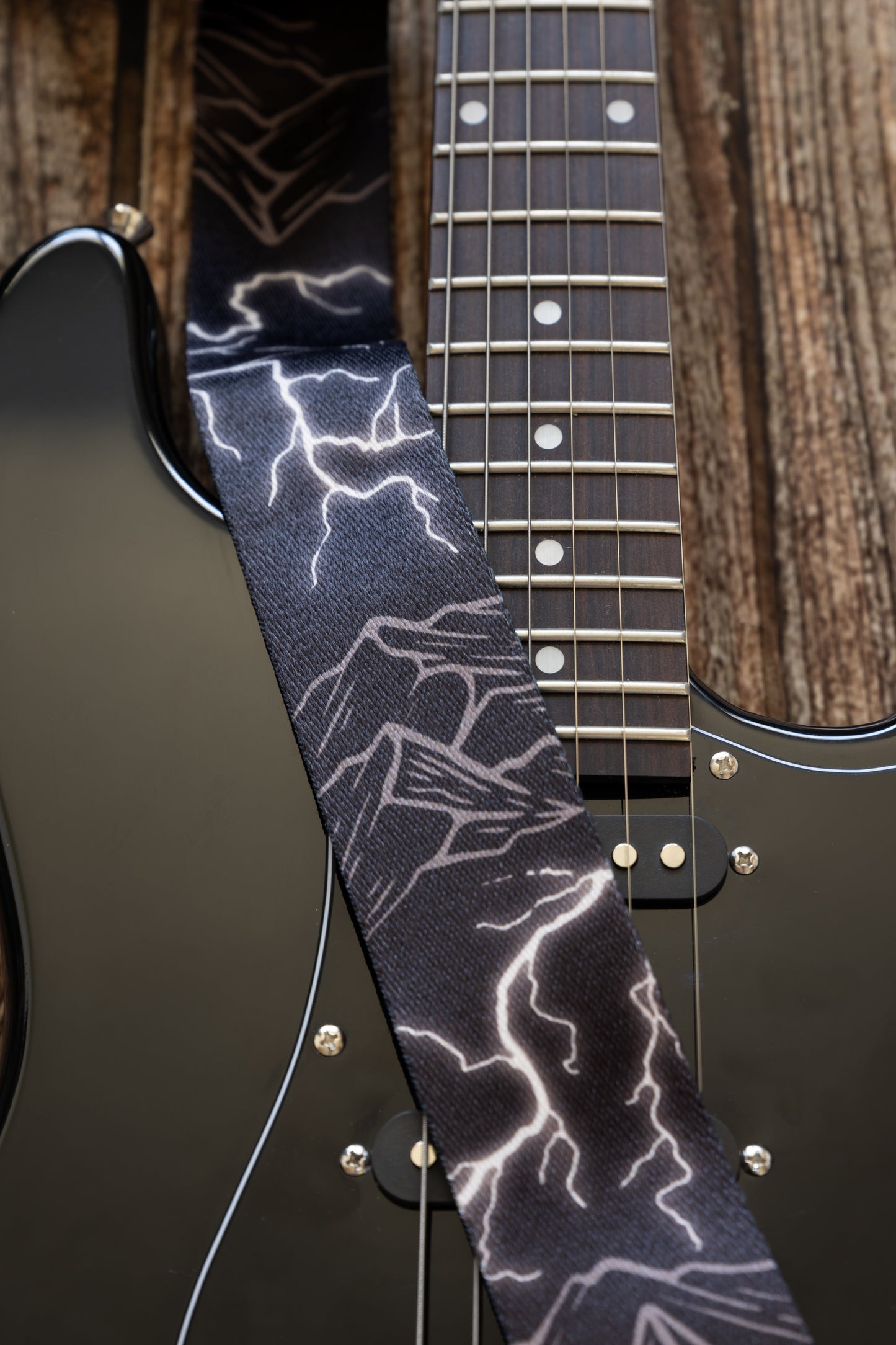 Thunder Mountain Guitar strap on black electric guitar