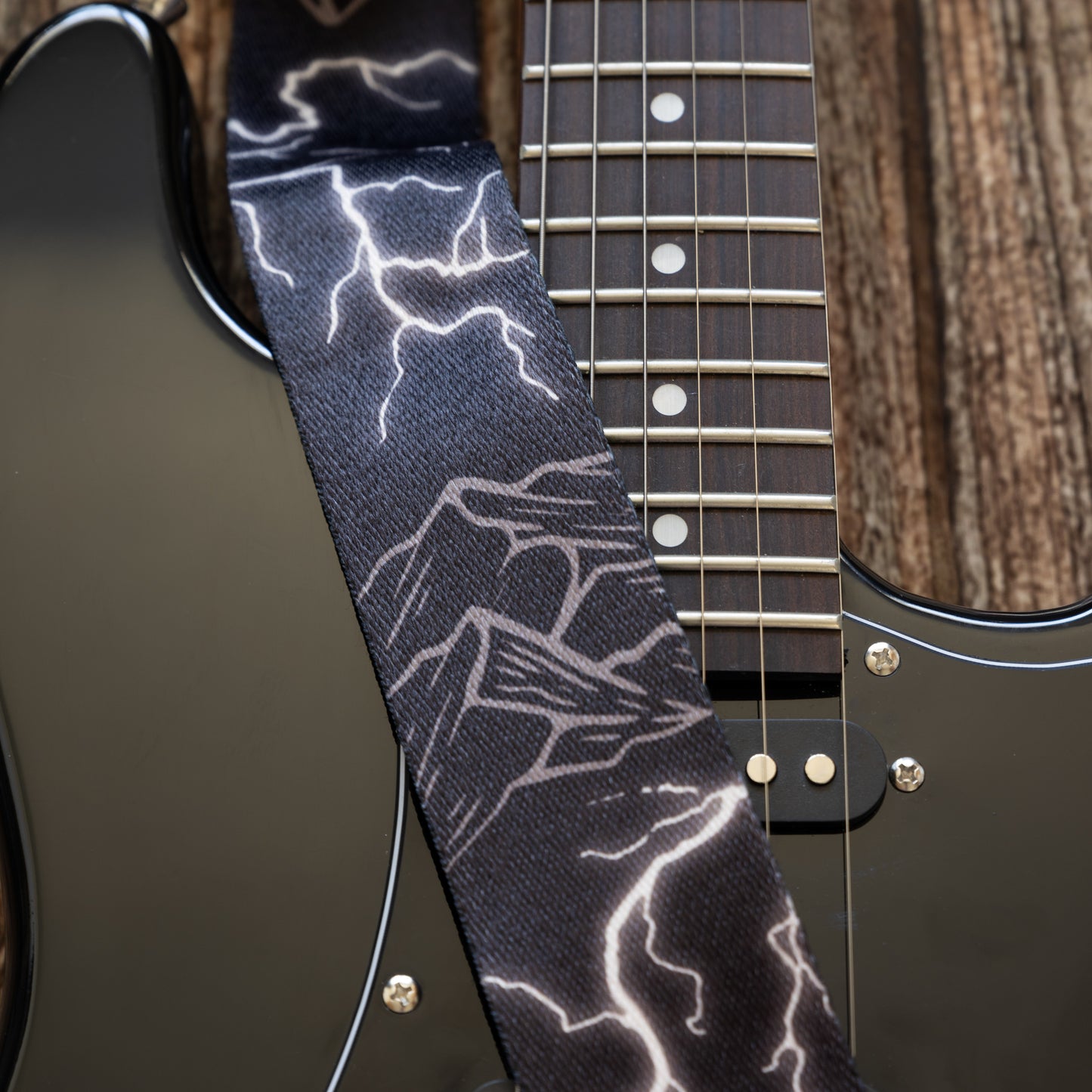 Thunder Mountain Guitar Strap on black electric guitar