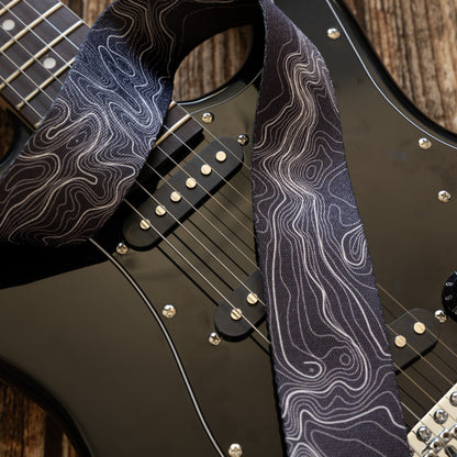 Topographic map designed black and white guitar strap.