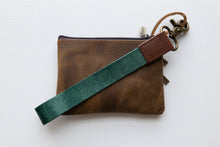 Load image into Gallery viewer, Tropical printed green wristlet keychain with brown leather ends and bronze hook attached to brown coin pouch
