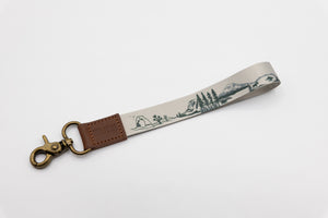 national park wristlet keychain with brown leather ends and bronze hook