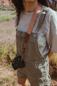 Women standing in field wearing Flower Field Brown Camera strap